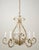 Bagues style chandelier with Louis XV influence in a gold finish wrought iron frame and glass foliate motifs. The flowers...