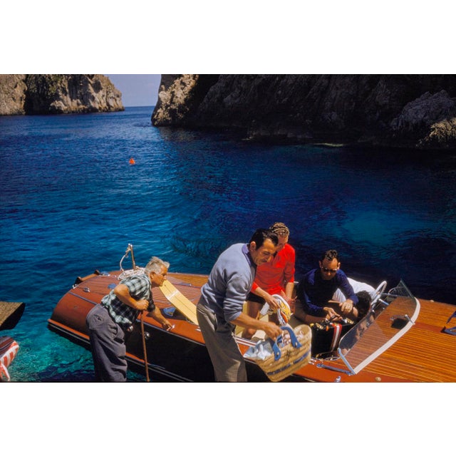 Capri Riva Boat Picnic by Toni Frissell A speedboat prepares for its trip onto the waters of Capri, 1959. (Toni Frissell)...