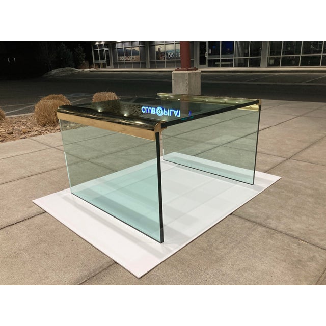 Post modern brass and glass waterfall coffee table Leon Rosen for Pace Collection, circa 1980s.