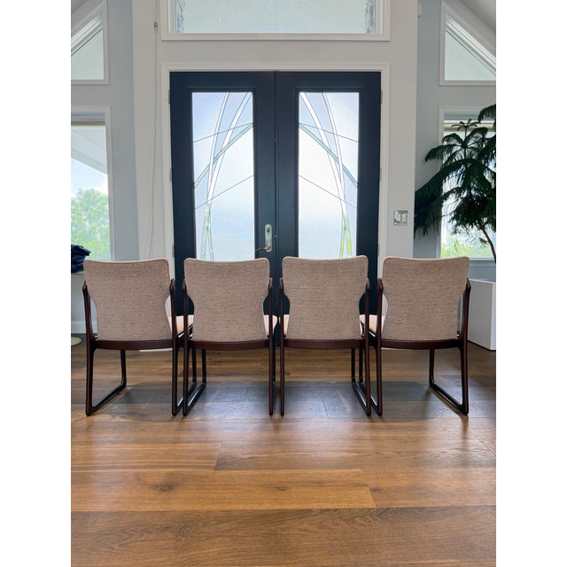 An exceptional set of four Danish Modern dining chairs crafted in Denmark during the height of Scandinavian Modern design....