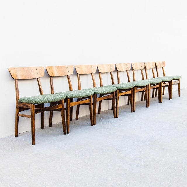 A set of eight beech and white oak dining chairs from Japan, made in the 1970s and newly reupholstered in a heathered moss...