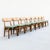 A set of eight beech and white oak dining chairs from Japan, made in the 1970s and newly reupholstered in a heathered moss...