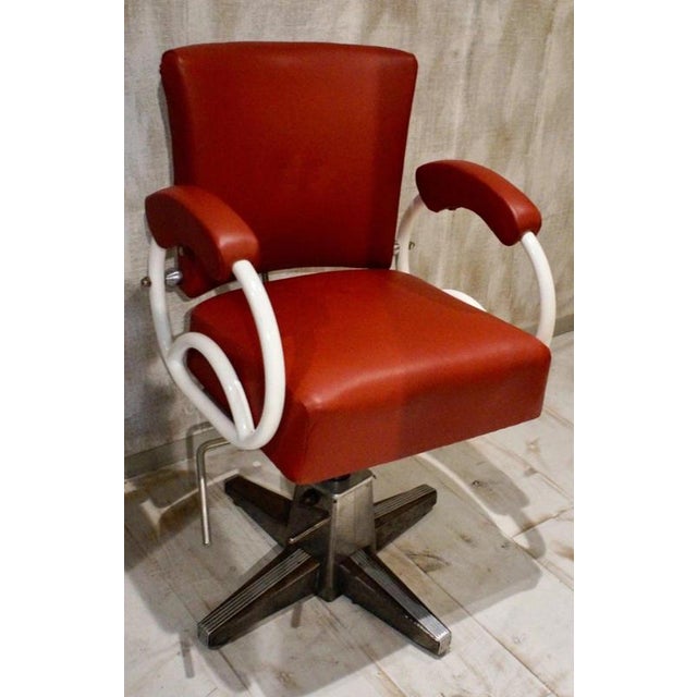 A characterful vintage barber’s and hairdresser’s chair dating to circa 1930, combining robust metal construction with...