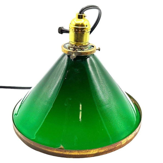 1920 industrial pendant lamp features a striking large 9" cone-shaped shade in emerald green glass, finished with brass...