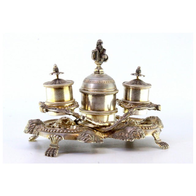 Silver Inkwell with Tanks, Bell with Reliefs, Applications and Claw-Shaped Feet, in Very Good conditions. Designed before...