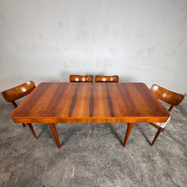 Elegant extendable dining table by jindřich halabala for up závody, featuring a smooth one-handed expanding mechanism that...