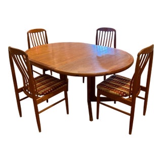Danish Modern Solid Teak Round Extendable Dining Set by Benny Linden | Table, 4 Spindle Chairs & 2 Leaves For Sale