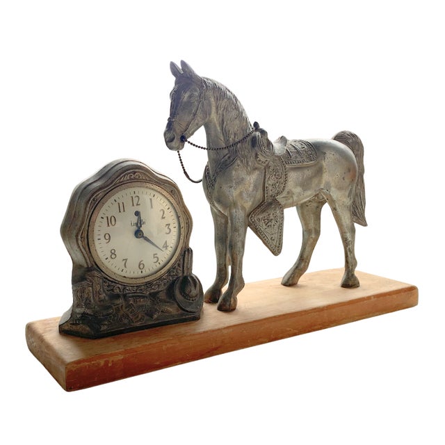 Vintage mid-century equestrian desk clock featuring a sculptural horse figure paired with a classic round timepiece, all...