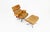 Swivel armchair in brown leather and wood by charles and ray eames for herman miller. Seat height: 40 cm. Both pieces are...