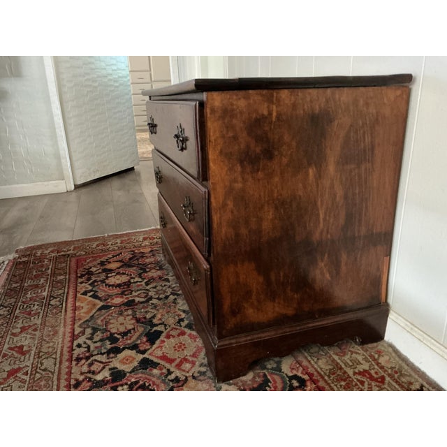 Very versatile chest, can be used as a nightstand or living room piece. 3 spacious draws and ornate brass pull handles....