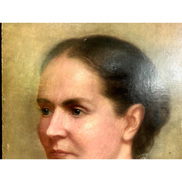This artwork is an original late 19th-century oil portrait depicting a woman in formal period attire. MYSTERY: Of special...