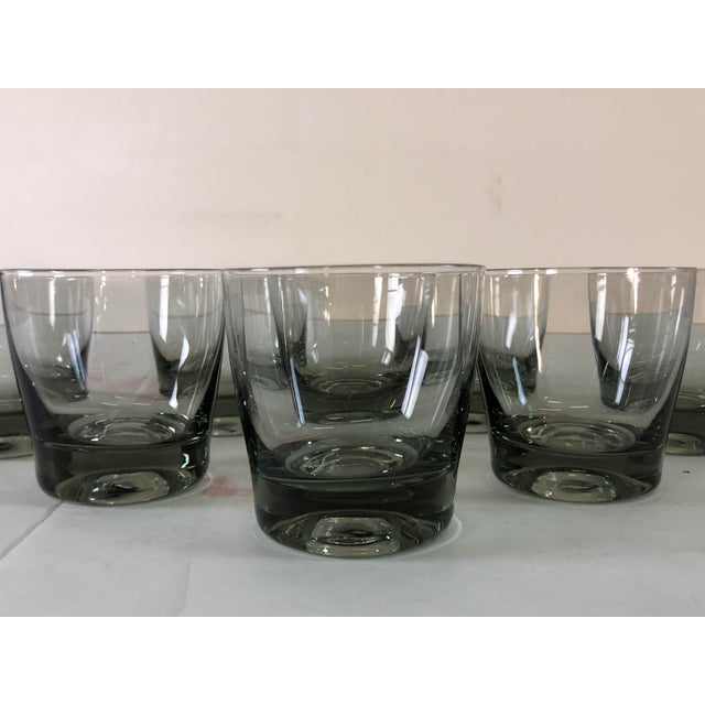 Vintage set of 8 small smoked glass bar tumblers with a heavy thick glass base. Holds 4 ozs. No marks.