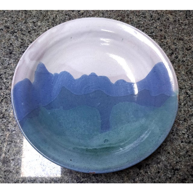 Lovely pair of American Studio ceramic plates with landscape-like glaze patterns in blues and greens. Signed and dated on...