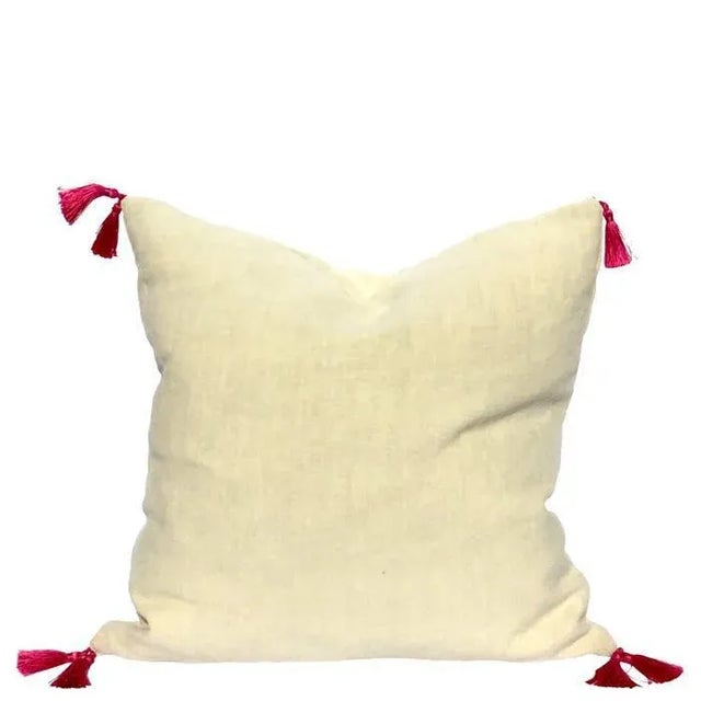 A small contemporary pillow made with our favorite soft linen and embellished with an Ikat jacquard border in bright...