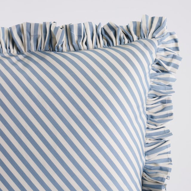 This pillow features Brigitte Stripe with a 1.5" ruffle finish. The perfect thin stripe, not too casual and not too...