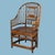 A handsome pair of highback Brighton Pavilion armchairs crafted from dark-stained bamboo with intricate spindle fretwork....