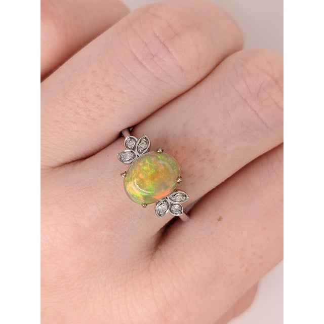 This chunky opal has all the colors of the rainbow, accented with natural earth mined diamonds to make an overall gorgeous...