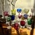 An exceptional and visually striking collection of eleven vintage colored crystal Roemer and liquor glasses, representing...