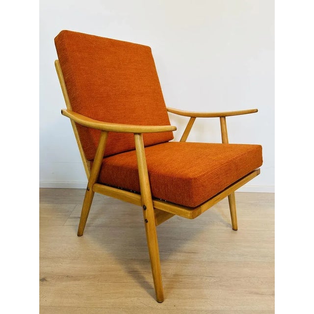 Orange Boomerang Armchair from Ton, Former Czechoslovakia, 1960s, in Restored conditions. Designed 1960 to 1969 This piece...