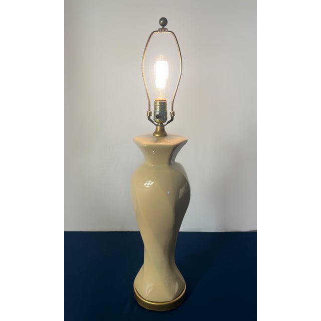 A commanding table lamp from Wildwood Lamps that serves as a masterclass in Postmodern Art Deco Revival design. The...