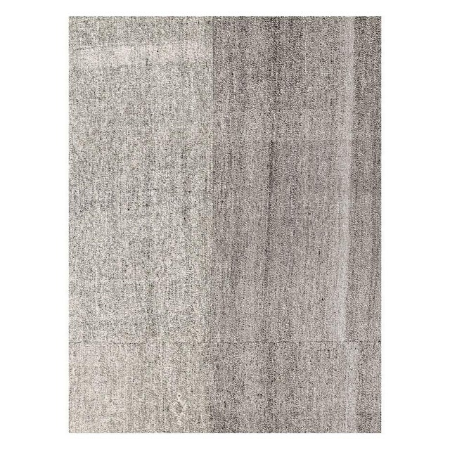 A vintage Turkish flat-weave Kilim room size carpet handmade during the mid-20th century with a salt and pepper design...