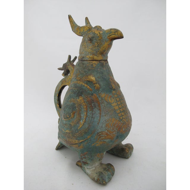 Archaic style Chinese bronze vessel, modeled after ritual bronze ware from the Western Zho Dynasty. Stylized bird pitcher...