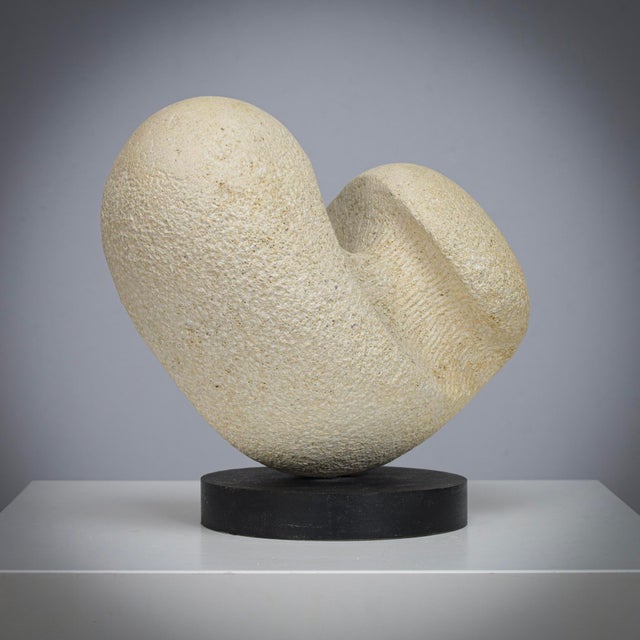 A modernist sandstone sculpture by dutch artist ineke van zuuren, created in the 1980s. The work embodies a soft, organic...