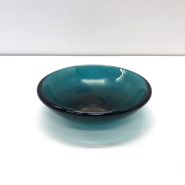 dark green glass whit iridescence, signed in acid "venini murano" on the base. This piece has an attribution mark, I am...