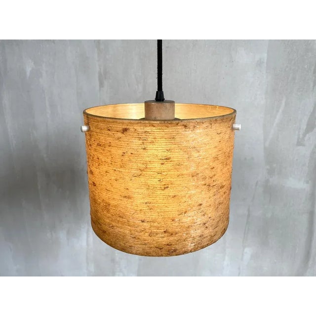 Counterweight wall lamp, Sweden 1960. Teak plate, chrome metal arm, black fabric thread. The reflector is made of braided...