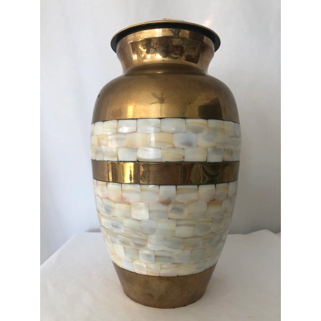 Offered is a stunning handcrafted Indian brass with mother-of-pearl inlay. urn. This fabulous piece was acquired from an...