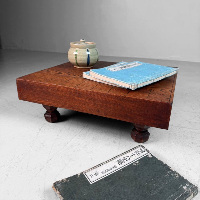 Elegant vintage Japanese shogi board, made in warm reddish-brown wood with a beautifully pronounced grain and deep natural...
