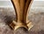 This vintage Florentine console is designed to hang on a wall. It is painted gold, with hand-carved detailing throughout,...