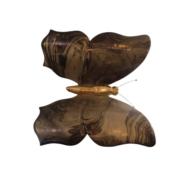 Large Italian wall light from the 1970s in the shape of a butterfly. The butterfly features a brass body with two large...