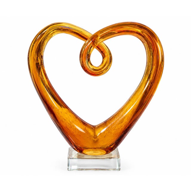 Sculptural vintage amber art glass heart with a warm golden-amber tone and beautifully fluid, hand-formed curves. The...