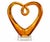 Sculptural vintage amber art glass heart with a warm golden-amber tone and beautifully fluid, hand-formed curves. The...