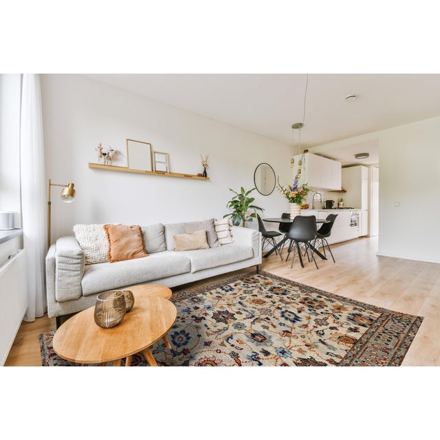 Iris Oushak Beige Hand Knotted Wool Rug, Country of Origin: India. This exquisite piece revives the grand scale and...