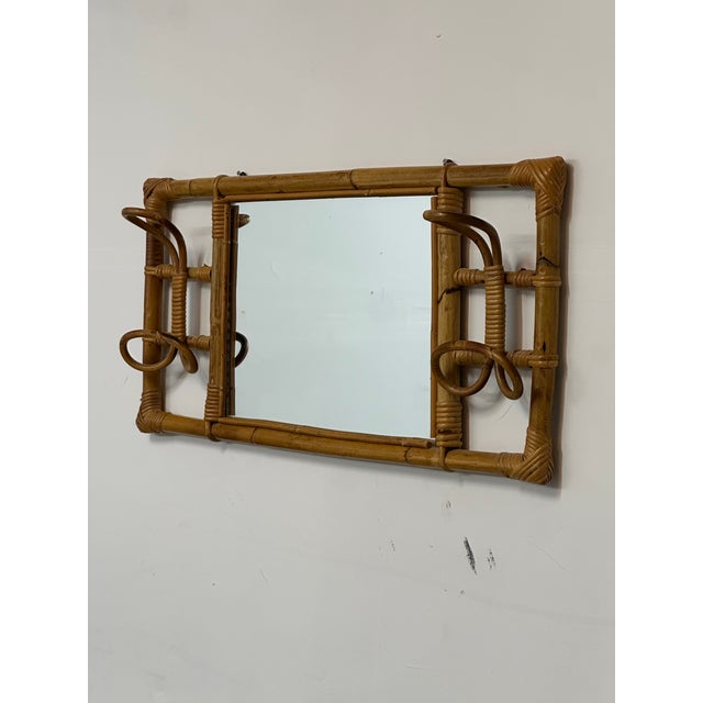 Wonderful wall mounted mirror with integrated coat/ hat rack. Produced in Italy circa 1960s for Rosenthal Netter. Great...