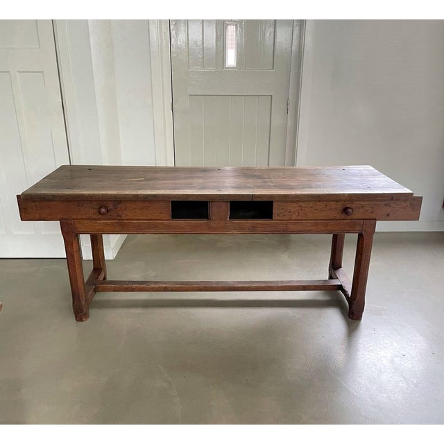 Antique wooden table, early 19th century, France. Top is made out of one piece of wood. Table has two “drawers” on each...