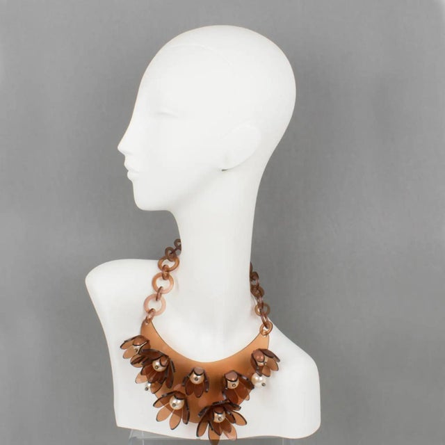 This striking transparent copper Lucite or Acrylic resin bib choker necklace was crafted by Italian designer Manoa2...