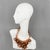 This striking transparent copper Lucite or Acrylic resin bib choker necklace was crafted by Italian designer Manoa2...