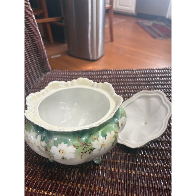 RS Prussia Biscuit or Cracker Jar which I would use for a sugar bowl. You could always display it in a collection. The...