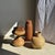 Large traditional woven basket, cylindrical in shape with a slightly flared tip, fitted with a lid. The structure is made...