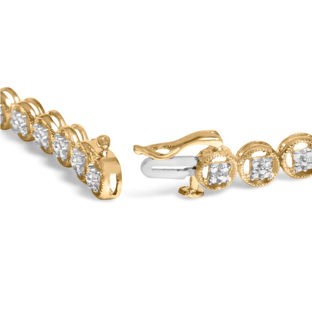 Grace your wrist with the timeless allure of our 14K Yellow Gold-Plated Sterling Silver Tennis Bracelet. Adorned with 17...
