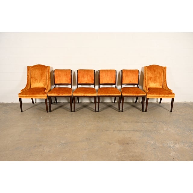 A gorgeous set of six Regency style dining chairs By Kittinger USA, Circa 1960s Carved mahogany frames, with upholstered...