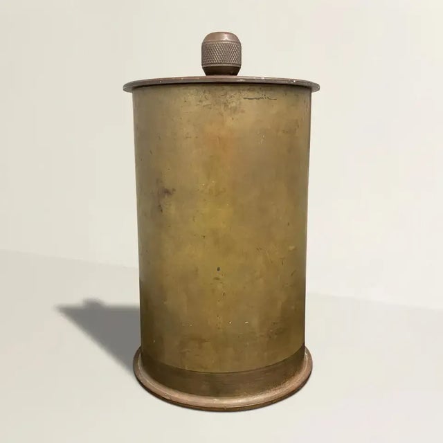 An incredible early 20th century American Folk Art bronze bank with a lid adorning a heavy knurled knob.