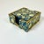 A lovely Chinoiserie Hollywood Regency Set of 6 Coasters with a matching caddy. The design is flora with a brass-colored...