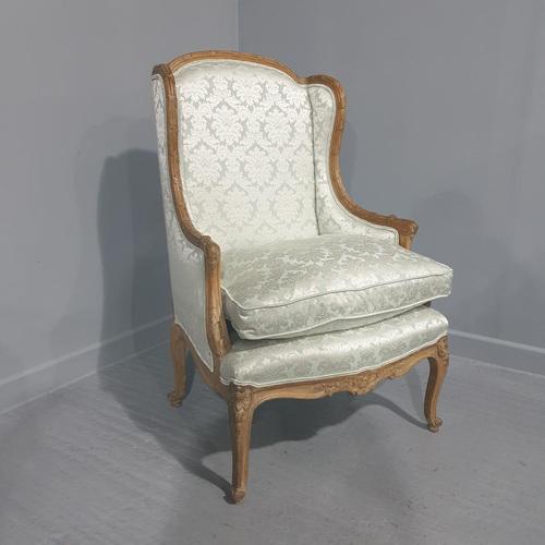 A lovely French bergere winged armchair, recently reupholstered in aqua marine damask. Very comfortable. Height:42 in...