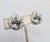 1950s rhodium plated pavé round clear rhinetones and round faux-sapphires flower clip earrings. Marked "JOMAZ" on the...