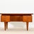 A striking mid-century Danish writing desk , designed and handcrafted in Denmark during the 1960s in richly grained dark...