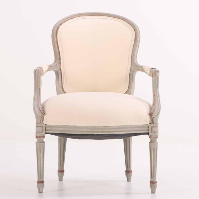 These comfortable grey painted and giltwood chairs envelop you with the arched crests and rounded backs, small padded arms...